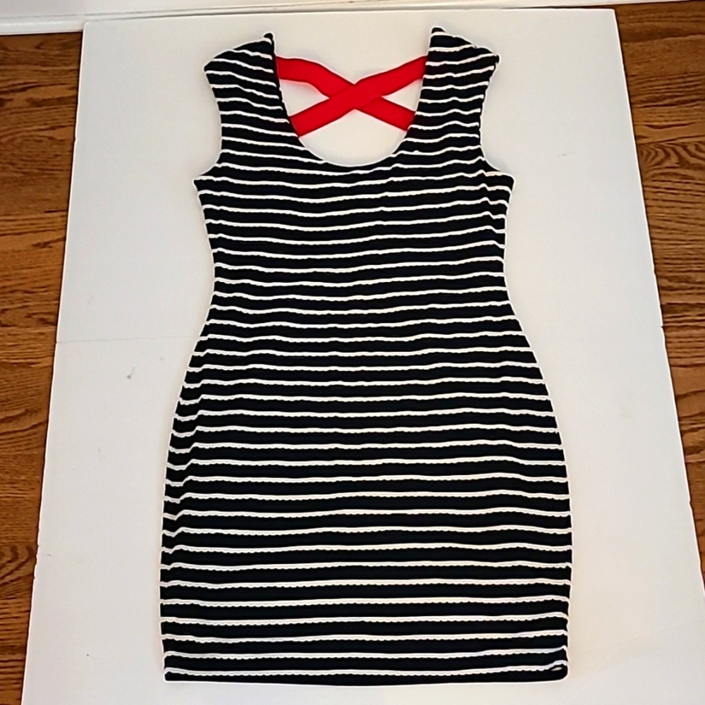 Blue and white form fitting Guess dress with red criss-cross straps on the back